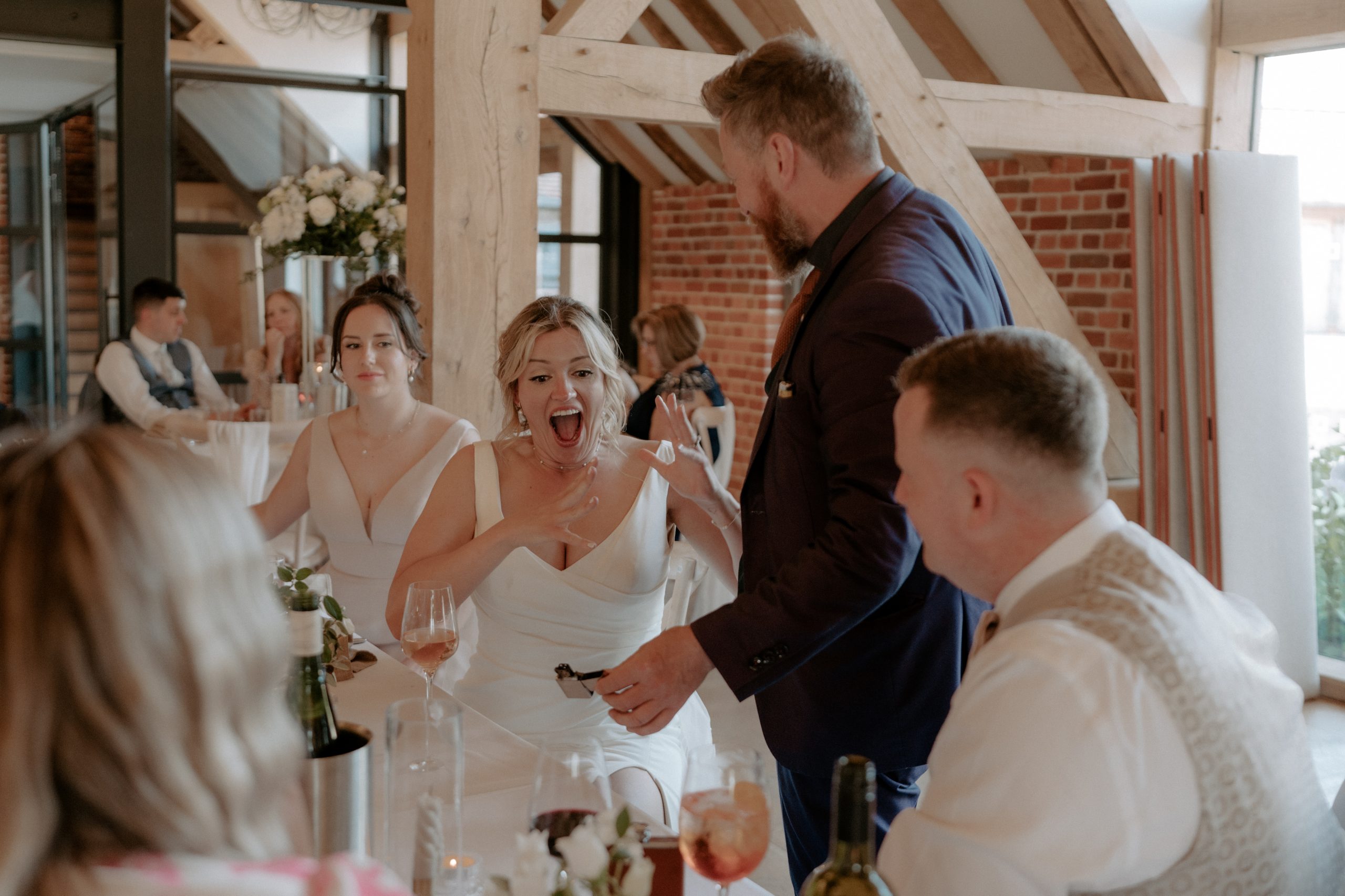 bride screens in amazement with magician